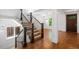 Elegant staircase leading to the upper level with hardwood floors and natural light at 1934 S Sherman St, Denver, CO 80210