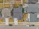 Overhead view showcasing the home's backyard, neighboring residences, and street layout at 10525 Akron St, Commerce City, CO 80640