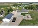 Aerial view of property showing the home, large shop, and surrounding land at 6331 County Road 32, Platteville, CO 80651