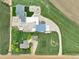 Expansive aerial view of the property showcasing home, garage, and surrounding land at 6331 County Road 32, Platteville, CO 80651