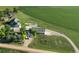 Expansive aerial view of property including residence, storage buildings, outbuildings, garage, and farm land at 6331 County Road 32, Platteville, CO 80651