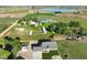 Expansive property with a modern house, outbuildings and picturesque views of the surrounding farmland and lake at 6331 County Road 32, Platteville, CO 80651