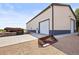 Large barn structure, with multiple garage doors and gravel driveway at 6331 County Road 32, Platteville, CO 80651