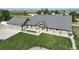 Charming single Gathering home with a landscaped front yard, 3-car garage, and covered entryway at 6331 County Road 32, Platteville, CO 80651