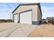 Spacious two-door garage with concrete floor and durable metal siding at 6331 County Road 32, Platteville, CO 80651
