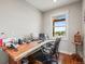 Functional home office space with custom desk and a window view at 6331 County Road 32, Platteville, CO 80651