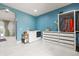 Spacious laundry room featuring a washer, dryer, shelving, and tile flooring at 6331 County Road 32, Platteville, CO 80651