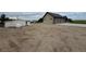 Spacious property featuring a detached garage, shed, and ample gravel space for versatile use at 6331 County Road 32, Platteville, CO 80651
