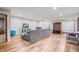 The finished basement features a spacious rec room with a cozy seating area and various game tables at 6331 County Road 32, Platteville, CO 80651