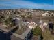 Aerial view of a neighborhood with a house featuring a well manicured lawn and mature trees at 15653 Split Creek Dr, Monument, CO 80132
