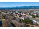 Breathtaking aerial view showcasing a vibrant neighborhood with stunning mountain views at 15653 Split Creek Dr, Monument, CO 80132
