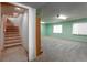 Unfinished basement with staircase and light green walls provides potential for customization at 15653 Split Creek Dr, Monument, CO 80132