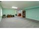 Spacious basement area, with light green walls, offers plenty of storage or recreational space at 15653 Split Creek Dr, Monument, CO 80132