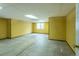 Unfinished basement with concrete flooring and yellow walls at 15653 Split Creek Dr, Monument, CO 80132
