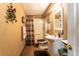Traditional bathroom features a shower-tub combo and vanity at 15653 Split Creek Dr, Monument, CO 80132