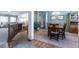 Cozy dining area featuring tile floors, wood furniture, and ample natural light, ready for Gathering meals at 15653 Split Creek Dr, Monument, CO 80132