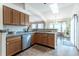 Charming eat-in kitchen features wood cabinets and floors and a skylight for natural light at 15653 Split Creek Dr, Monument, CO 80132