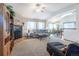 Inviting living room with a fireplace and large windows, perfect for relaxing and entertaining guests at 15653 Split Creek Dr, Monument, CO 80132