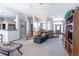 Spacious open-concept living room with neutral decor and plenty of natural light, great for gatherings at 15653 Split Creek Dr, Monument, CO 80132
