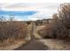 Picturesque neighborhood trail surrounded by nature, perfect for walking, running, and enjoying the outdoors at 15653 Split Creek Dr, Monument, CO 80132