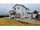 The backyard features a concrete patio, pergola, and a shed with an adjacent stone parking area at 12135 Elizabeth St, Thornton, CO 80241