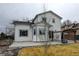 A cozy backyard with a concrete patio, a pergola, and a young tree at 12135 Elizabeth St, Thornton, CO 80241