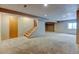A finished basement area with carpet, stairs, a closet area, and recessed lighting at 12135 Elizabeth St, Thornton, CO 80241