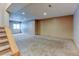 A spacious basement with neutral carpet, recessed lighting, and natural light from a window at 12135 Elizabeth St, Thornton, CO 80241