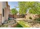 Spacious backyard features a patio and a privacy fence at 2035 Overland Dr, Brighton, CO 80601