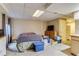 Basement with bedroom, TV area, and kitchenette, offering ample living space at 2035 Overland Dr, Brighton, CO 80601