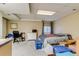 Basement area with desk, bed, and storage; a flexible space for various needs at 2035 Overland Dr, Brighton, CO 80601