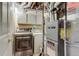 Basement laundry area with washer, dryer and utility sink at 2035 Overland Dr, Brighton, CO 80601