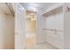Well-lit closet providing ample shelving and hanging storage solutions and leading to the bedroom at 2035 Overland Dr, Brighton, CO 80601