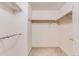 Walk-in closet features shelving and hanging rods for ample storage space and organization at 2035 Overland Dr, Brighton, CO 80601