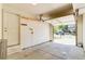 Spacious garage with an open door, concrete flooring, and access to a side door at 2035 Overland Dr, Brighton, CO 80601