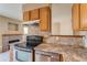 Updated kitchen with sleek stainless steel appliances at 2035 Overland Dr, Brighton, CO 80601