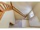 Bright foyer with a wooden staircase and a window providing natural light near the entrance at 2035 Overland Dr, Brighton, CO 80601