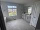 Bathroom with dual sinks, a large mirror, neutral tile flooring, and a large window at 4284 Ridgewalk Pt, Castle Rock, CO 80108