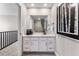 Well-lit bathroom featuring a vanity with drawers, a large mirror, and neutral tones for a clean and modern aesthetic at 4284 Ridgewalk Pt, Castle Rock, CO 80108