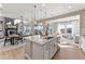 Open kitchen with a large island, modern appliances, and seamless transition to the living areas at 4284 Ridgewalk Pt, Castle Rock, CO 80108