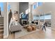 Bright living room featuring a fireplace, comfortable seating, and large windows with a view at 4284 Ridgewalk Pt, Castle Rock, CO 80108