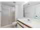Clean bathroom with a glass-enclosed shower, white vanity, and a large mirror, offering a functional design at 11 Canongate Ln, Highlands Ranch, CO 80130