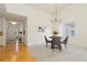 Open concept dining room and entry with hardwood floors at 11 Canongate Ln, Highlands Ranch, CO 80130