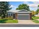 Single-Gathering home with an attached garage and manicured lawn in a serene suburban setting at 11 Canongate Ln, Highlands Ranch, CO 80130