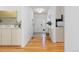 Inviting foyer showcasing hardwood floors, a bright white door, and elegant decor at 11 Canongate Ln, Highlands Ranch, CO 80130