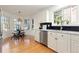 Eat-in kitchen features wood floors, a bay window, and stainless steel appliances at 11 Canongate Ln, Highlands Ranch, CO 80130