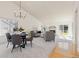 Open living space with vaulted ceilings, neutral carpet, and fireplace at 11 Canongate Ln, Highlands Ranch, CO 80130