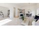 Open-concept living space with view to the dining room and office at 11 Canongate Ln, Highlands Ranch, CO 80130