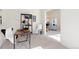 Office space with shelves and view to open concept living space at 11 Canongate Ln, Highlands Ranch, CO 80130