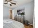 Cozy bedroom with hardwood floors, ceiling fan, and stylish décor at 6664 Gray St, Arvada, CO 80003